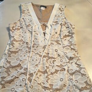 Venus white lace up top with nude underlay. Size Small